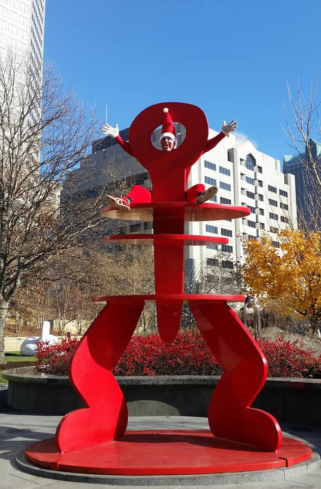 Pat Waterkotte as the Creepy Elf with Keith Haring's Untitled (Ringed Figure) in City Garden, St. Louis. Photo: Dawn Boly.