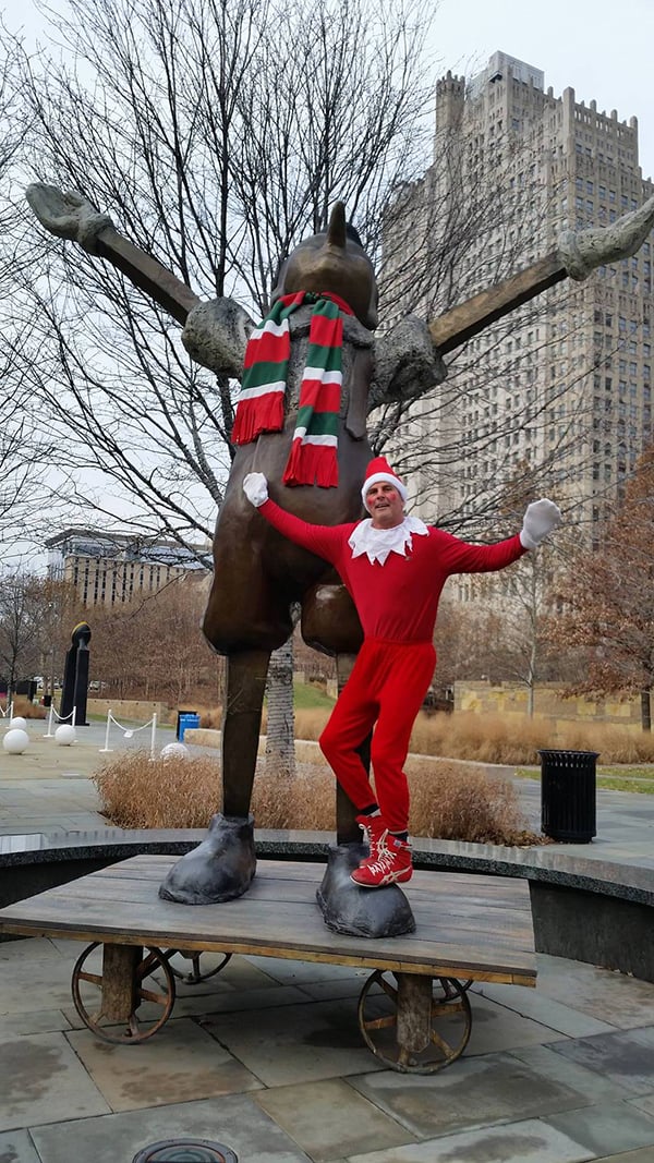 Pat Waterkotte as the Creepy Elf with Jim Dine's Big White Gloves, Big Four Wheels in Garden Park, St. Louis. Photo: Dawn Boly.