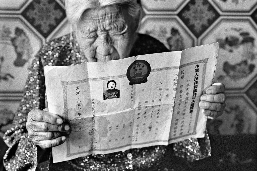 Ahn Sehong, Park Dae-im, born in 1912, holds her only form of personal identification, a residence permit issued when she was sent to a comfort station in what is now Shenyang, China, in 1934. Photo: Ahn Sehong.