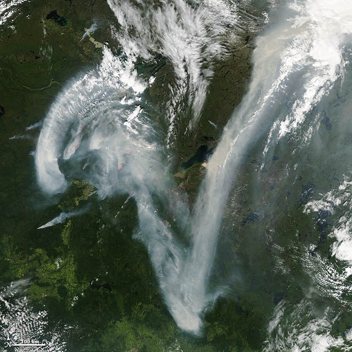 This image was acquired on July 11, 2012, by the Aqua satellite, of wildfire smoke over the Caribou Mountains of northern Alberta, Canada. Photo: NASA, courtesy Jeff Schmaltz, LANCE MODIS Rapid Response.
