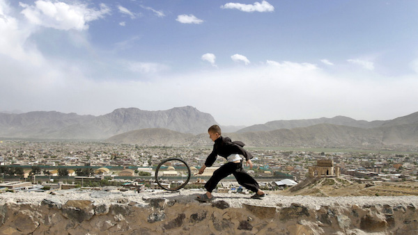 Francis Alÿs, Children's Game #7 ­ Hoop and Stick (Bamiyan, Afghanistan) (2010).Photo: Ajmal Maiwandi Courtesy 32nd Bienal de São Paulo.