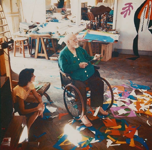 Henri Matisse and a studio assistant working on cut-outs at the Hôtel Régina, Nice, 1952. <br>Image: Lydia Delectorskaya, © 2014 Succession H. Matisse</br>