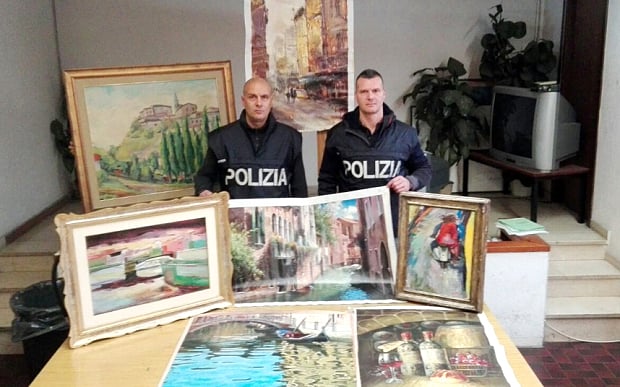 Italian police with the recovered paintings. Photo: Polizia di Stato.