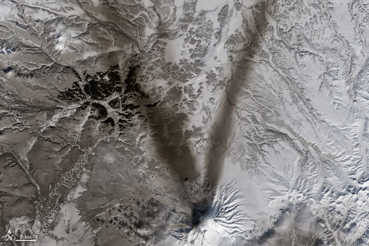 Big V. Little V. What begins with V? Vast volumes of volcanic ash veering in variable winds! Vladivostok, Venice, and Venezuela’s Lake Valencia. On March 23, 2015, the Operational Land Imager (OLI) on Landsat 8 acquired this image of ash on the snow around Shiveluch—one of the largest and most active volcanoes on Russia’s Kamchatka Peninsula. Photo: courtesy NASA, caption by Adam Voiland.