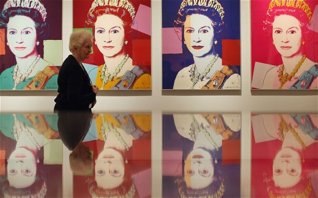 Andy Warhol Queen Elizabeth screen prints at the National Portrait Gallery, London. Works from the series are hung in British embassies in the US. Photo: Anthony Devlin/PA; Oli Scarff/Getty Images.