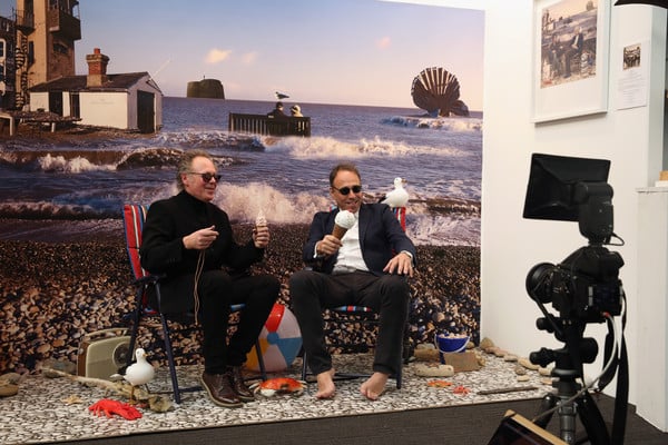 Anthony Horowitz (right) takes his shoes and socks off at Bill Jackson's Aldeburgh Beach Pop-Up on Caroline Wiseman's stand at the London Art Fair. Photo: courtesy Caroline Wiseman Modern and Contemporary