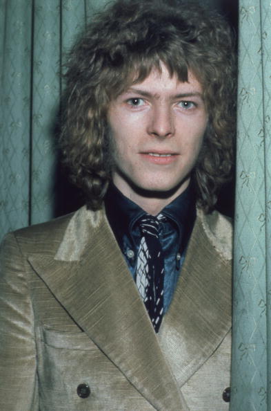 February 1970: Pop singer David Bowie at the 'Disc and Music Echo' Valentine Awards ceremony at the Cafe Royal in London. Photo: Hulton Archive/Getty Images.