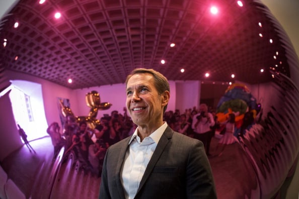 Artist Jeff Koons poses for a portrait for the media in front of his work Moon (Light Pink) during a media preview of his retrospective at the Whitney Museum of American Art on June 24, 2014 in New York. Photo: Andrew Burton/Getty Images.