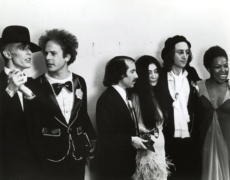 Ron Galella, David Bowie, Art Garfunkel, Paul Simon, Yoko Ono, and John Lennon at the Grammy Awards, New York, 1975 (1975). Photo: Artnet.