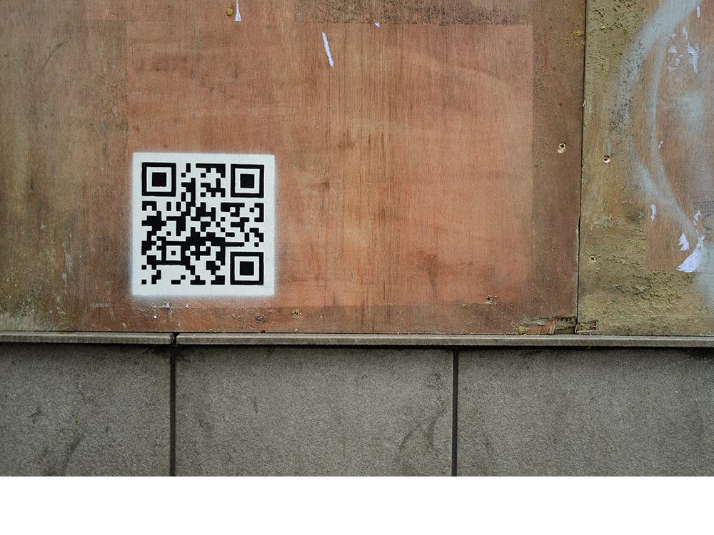 A QR code links to a video of French police clearing the calais refugee camp. It is believed to be Banksy's first interactive work. Photo: banksy.co.uk