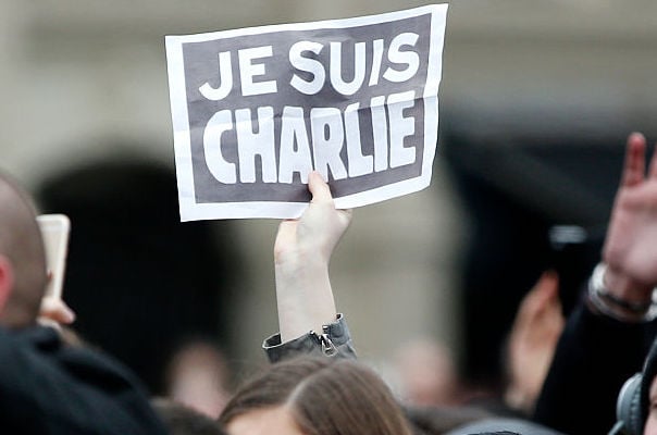 A person holds a placard reading "Je suis Charlie" during a remembrance rally at Place de la Republique on the one year anniversary of the attacks. Photo: YOAN VALAT/AFP/Getty Images