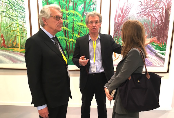 Jean Frémon and Patrice Cotensin from Galerie Lelong Paris speak to artnet News at ARCO Madrid 2016, with a series of David Hockney’s iPad drawings behind.<br>Photo: Niklas Thamm.
