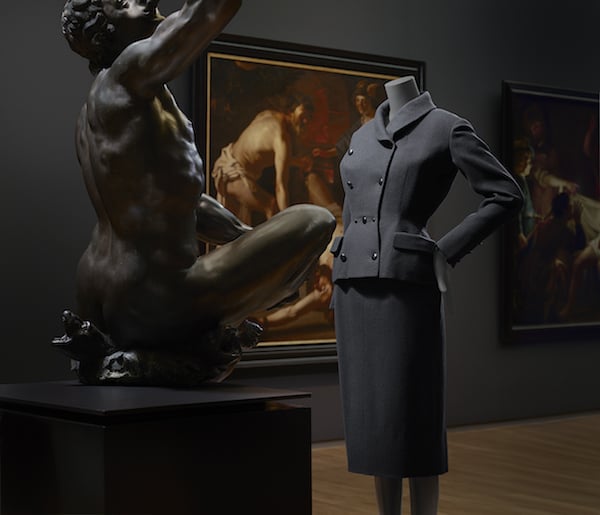 Installation view of “Catwalk” at the Rijksmuseum, featuring a 1952 dress with matching jacket by Christian Dior.<br>Photo: Erwin Olaf, Courtesy Rijksmuseum.