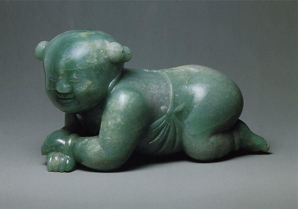 Pillow in the shape of an infant boy, jade, Qing dynasty. <br>Photo: gift of Heber R. Bishop, courtesy the Metropolitan Museum of Art.