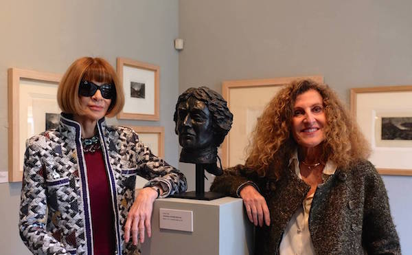 Anna Wintour and Nicole Farhi pose with Farhi’s bust of Thomas Gainsborough at Gainsborough’s House on Monday.Photo: Courtesy Hignell Gallery.