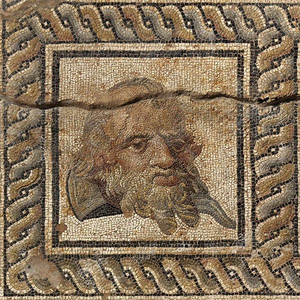 Mosaic panel with theatrical mask of Silenus (circa late 2nd century AD–early 3rd century AD). Photo: © Hellenic Ministry of Culture and Spots, Archaeological Receipts Fund, courtesy the Ephorate of the Antiquities of Pierie and the Dion Excavations.