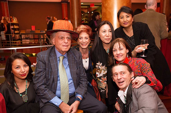Guests at the Rubin Museum's Asia Week Celebration, including museum founders Donald Rubin (in hat) and Shelley Rubin (to his right), and Maura Moynihan (in red coat). <br /> Photo: Michael Seto.