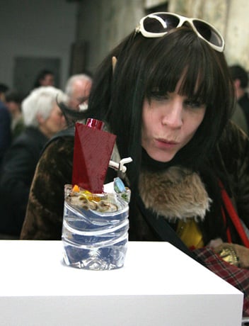 Reverend Jen examining Michaela Eichwald’s Volvic Architecture Milfina at Reena Spaulings Fine Art, 2008<br> Photo by George Courtney