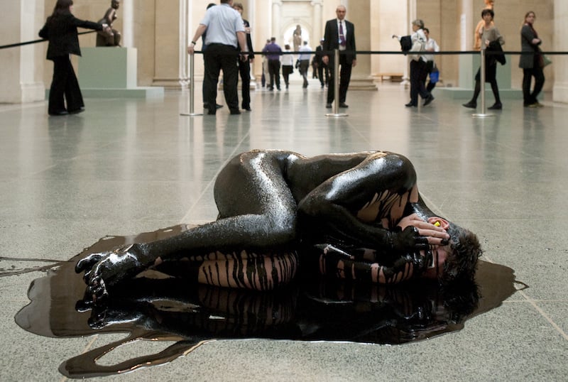 Amy Scaife's protest performance <i>Human Cost</i> at the Tate Britain's Duveen gallery in 2011. Courtesy Liberate Tate