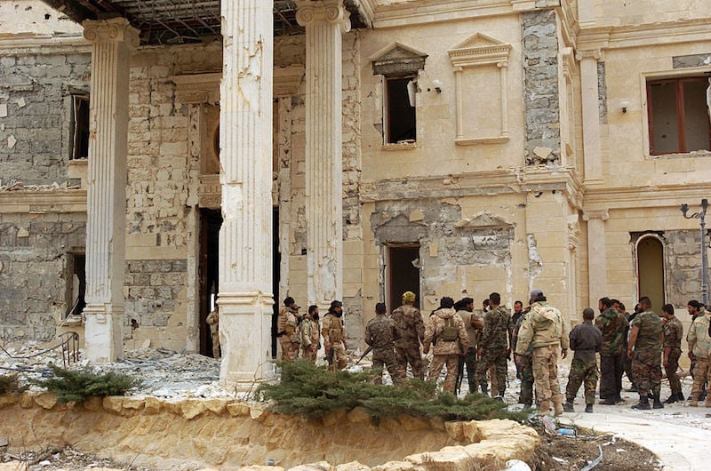 Syrian government troops assemble on the outskirts of Palmyra. Photo: STR/AFP/Getty Images