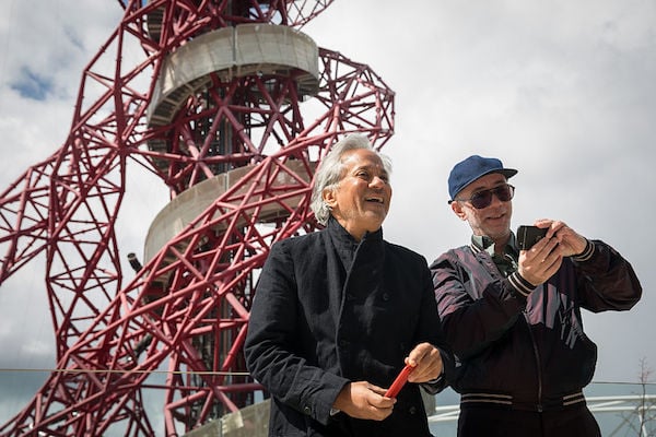 Anish Kapoor and Carsten Höller pose for photographers in front of London’s ArcelorMittal Orbit tower on April 26. Photo: Rob Stothard/Getty Images.