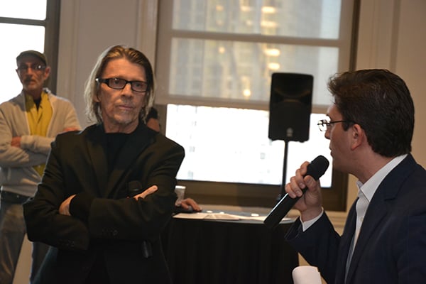 Jason Rulnick, specialist in post-war and contemporary art for artnet Auction, introduces Christopher Makos, a photographer from the Andy Warhol Factory at the opening of "Andy’s A-List: Warhol Photographs" at artnet. Courtesy Rita Salpietro/artnet. 