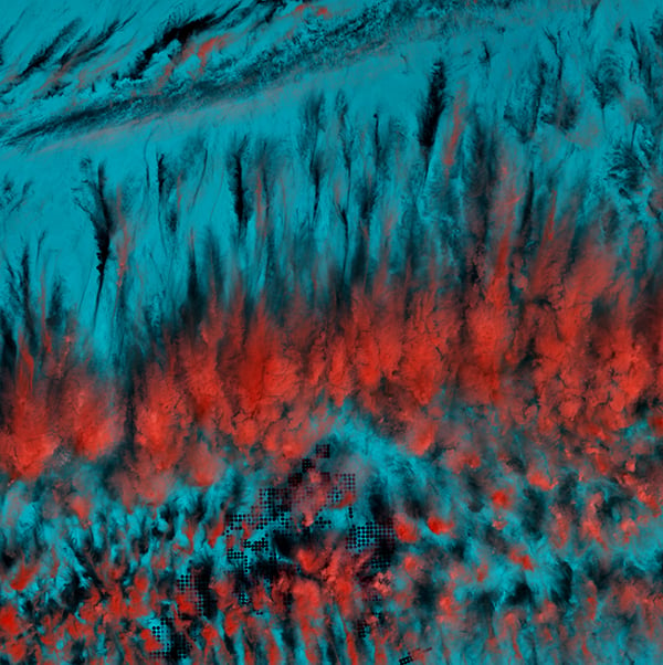 <em>Eerie Cloud Shadows</em>, "Earth as Art," March 22, 2014. <br>These cloud patterns cast eerie shadows on the landscape of southern Egypt. The clouds appear red and the desert below hazy blue in this infrared rendition. <br>Photo: USGS.