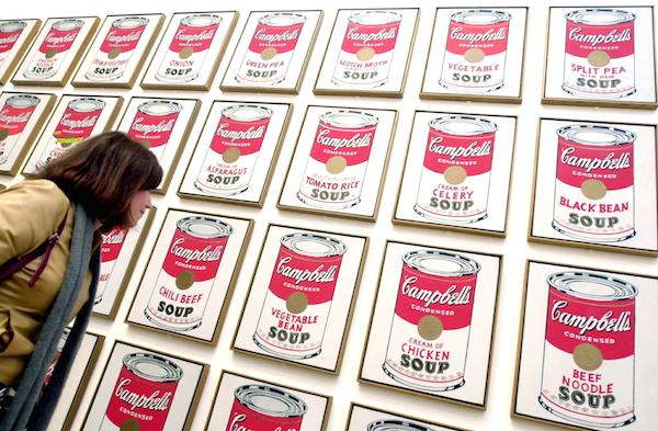 A visitor looks at enigmatic American artist Andy Warhol's 