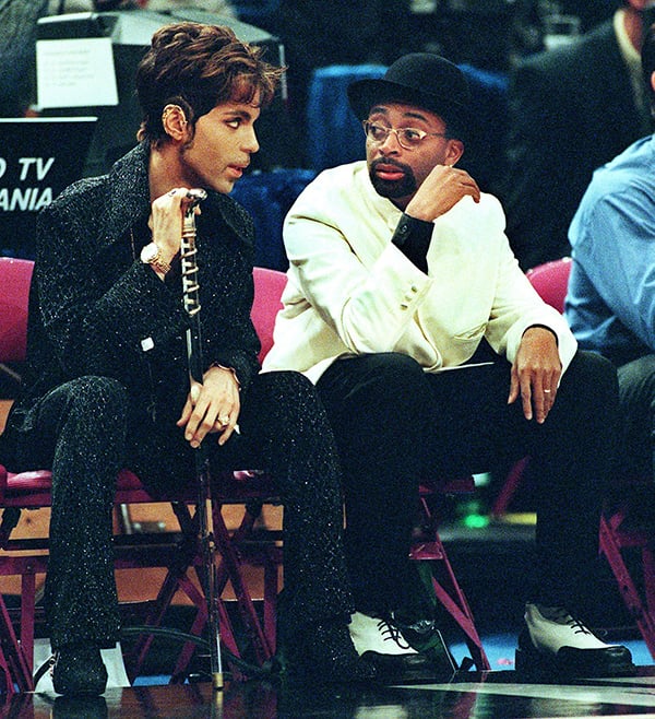 Filmmaker Spike Lee talks with the musician formerly known as Prince during the 1998 NBA All Star Game at Madison Square Garden. <br>Photo: Timothy A. Clary/AFP/Getty Images.