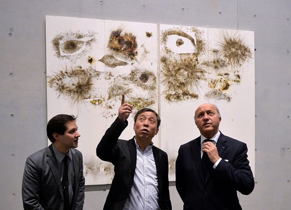 French Foreign Minister Laurent Fabius (R) and unidentified officials tour the Long Museum West Bund in Shanghai on May 17, 2014. Fabius who is a former French Prime Minister is on a 4 day visit to China with stops in Hangzhou, Shanghai and Beijing. AFP PHOTO/Mark RALSTON (Photo credit should read MARK RALSTON/AFP/Getty Images)