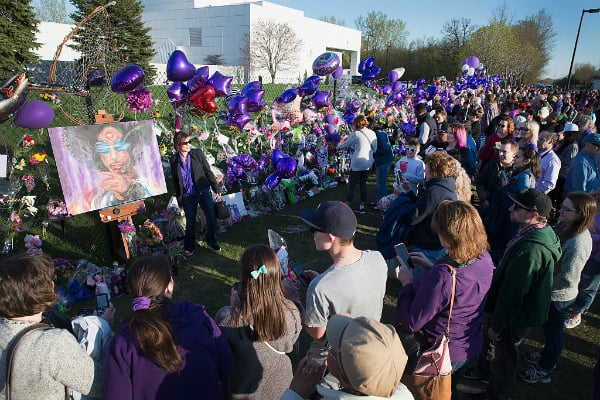 Music fans visit a memorial outside Paisley Park, the home and studio of Prince, on April 22, 2016 in Chanhassen, Minnesota.Photo: Scott Olson/Getty Images.