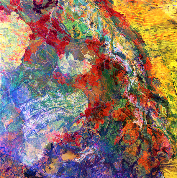 <em>Melted Colors</em>, "Earth as Art," December 5, 2014. Br>This enhanced image of Western Australia resembles a mixture of crayons that melted in the sun. The yellow sand dunes of the Great Sandy Desert cover the upper right portion of the image. Red splotches indicate burned areas from grass and forest fires, and the colors in the rest of the image depict different types of surface geology. <br>Photo: USGS.