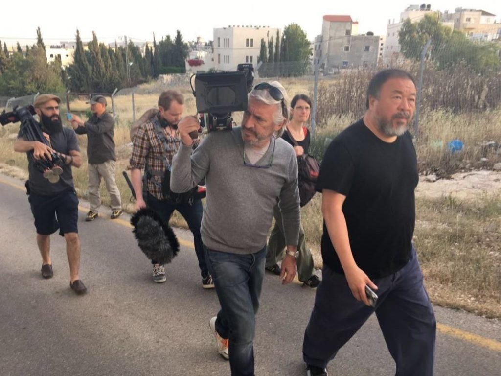 Ai Weiwei and a film crew in the West Bank, Monday, May 9. Courtesy of Einat Fishbain via Facebook.