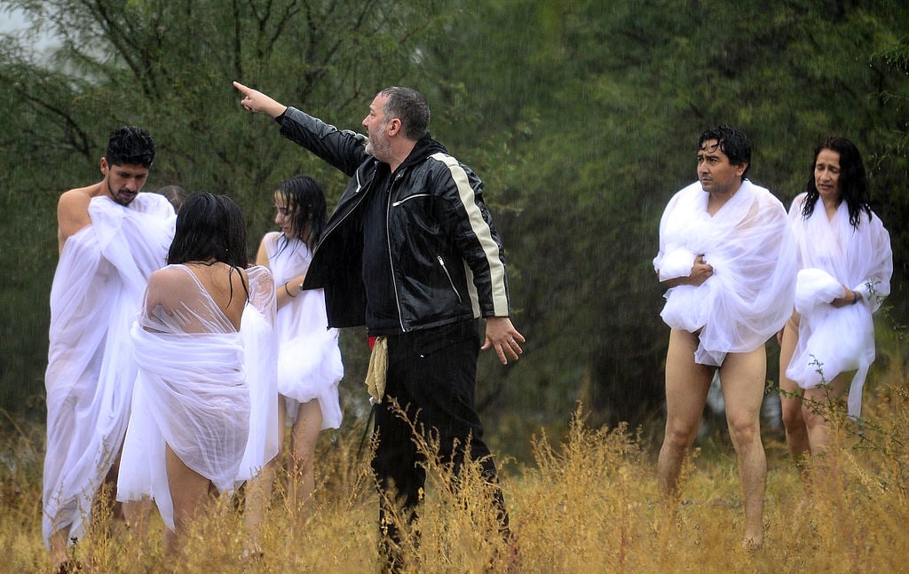Spencer Tunick gives instructions to naked volunteers before a perfomance at Los Senderos Villages in San Miguel de Allende municipality, Guanajuato State, Mexico on November 4, 2012. Courtesy of ALFREDO ESTRELLA/AFP/Getty Images.