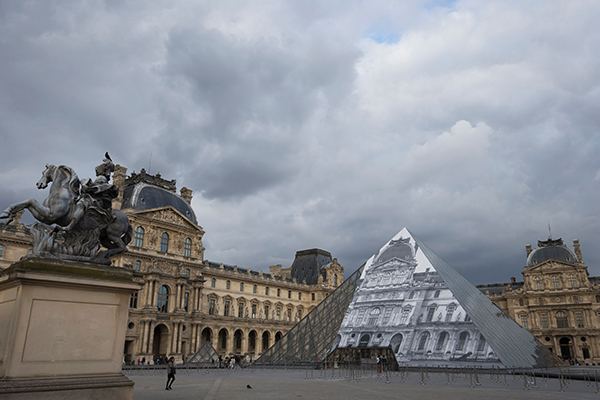 "JR at the Louvre." Courtesy of Joel Saget/AFP/Getty Images.