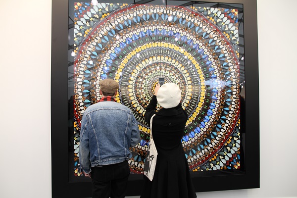 Visitors to Frieze New York at Gagosian Gallery's Damien Hirst booth. Courtesy of Sarah Cascone.