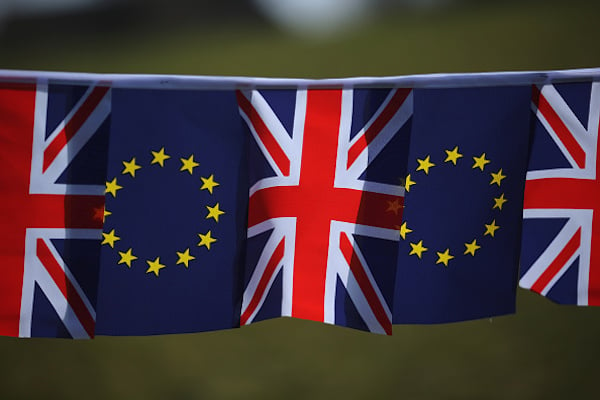 The European Union and the Union flag sit together on bunting on March 17, 2016 in Knutsford, United Kingdom. Photo: Christopher Furlong/Getty Images.