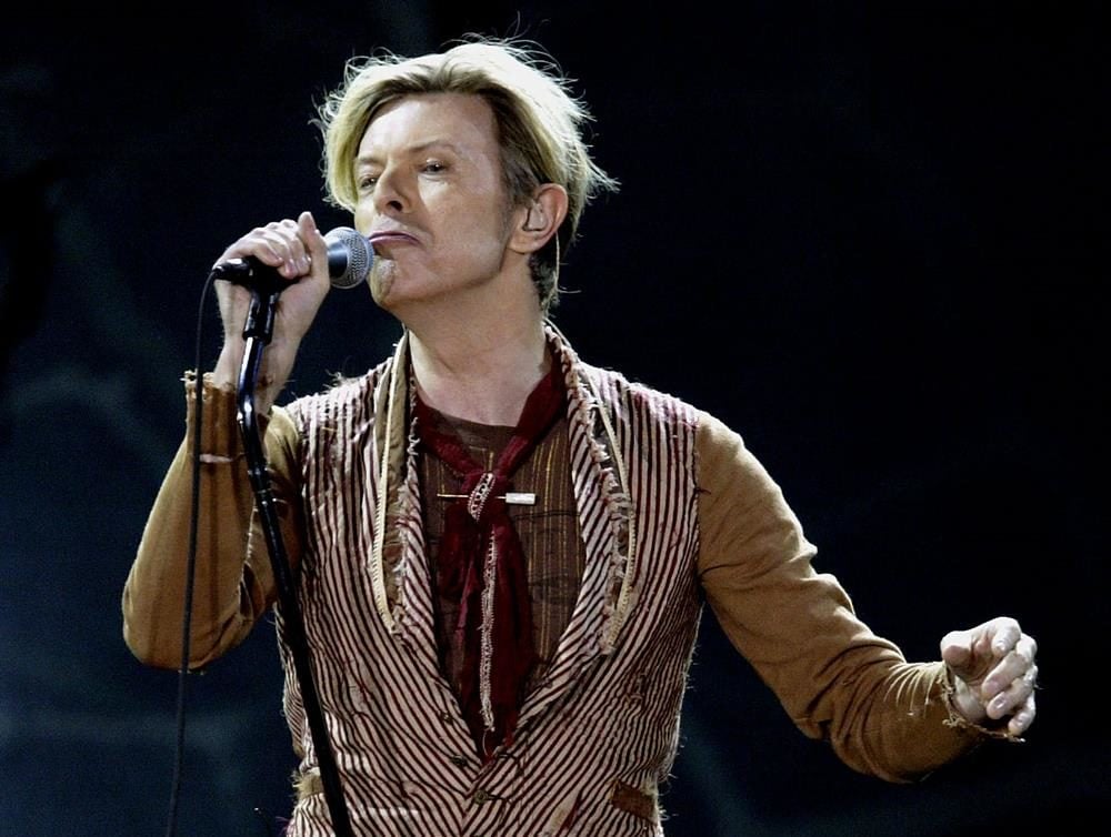 David Bowie performs on the first night of his UK tour at the MEN Arena on November 17, 2003 in Manchester, England. Courtesy of Alex Livesey/Getty Images.