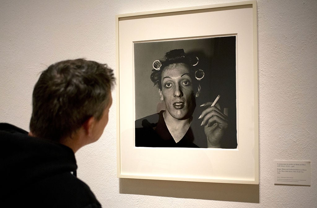 A visitor looks at the work of US photographer Diane Arbus at an exhibition at the Martin-Gropius-Bau in Berlin, on September 24, 2012, the final day of the three-month-long retrospective. Courtesy of DAVID GANNON/AFP/GettyImages.