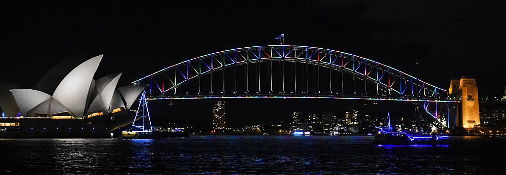 The Sydney Harbour Bridge is lit with the colours of the rainbow on June 13, 2016, in remembrance of victims after a gunman opened fire in a gay nightclub in Orlando, Florida in the worst mass shooting in modern US history. The Sydney Harbour Bridge was lit with the colours of the rainbow on June 13 as hundreds of Australians gathered to stand in solidarity with the global gay community after the worst mass shooting in modern US history. / AFP / WILLIAM WEST (Photo credit should read WILLIAM WEST/AFP/Getty Images)