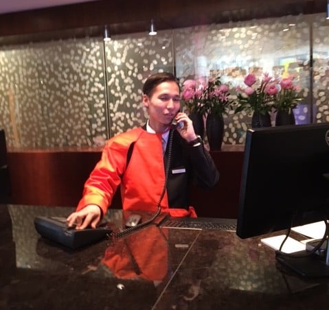 An employee at the Pak Hyatt wearing Franz Erhard Walthers "Half Vest" for Manifesta 11. Photo courtesy of the author