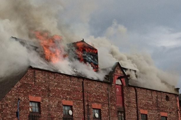 The Saw Mill, a planned Liverpool Biennial venue, on fire. Courtesy of the Liverpool Echo.