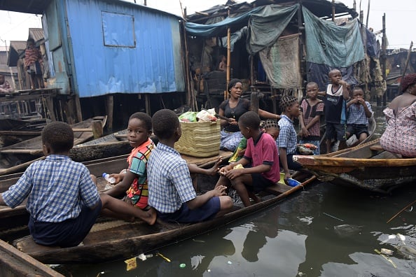 People travel to school by canoe on June 9, 2016 in Lagos, following the collapse of the Floating School. Photo Pius Utomi Ekpei/AFP/Getty Images.