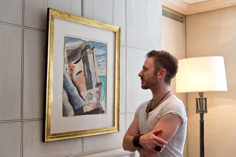 Ollie Dabbous admires John Piper’s Beach II. Courtesy of Sotheby's London.