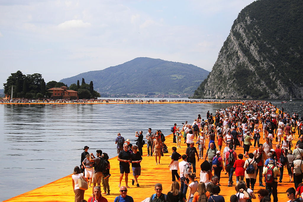 Visitors to Christo's Floating Piers (2016) overwhelmed local authorities. Photo: MARCO BERTORELLO/AFP/Getty Images