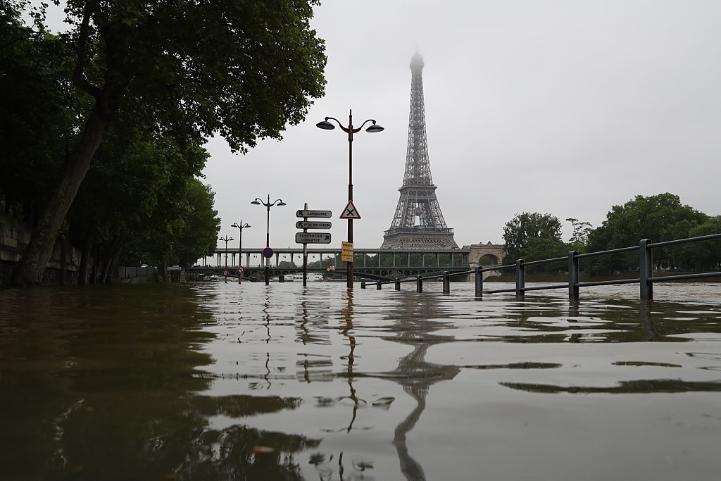 The river Seine bursting its banks next to the Eiffel Tower in Paris on June 2. Photo Kenzo Tribouillard/AFP/Getty Images.