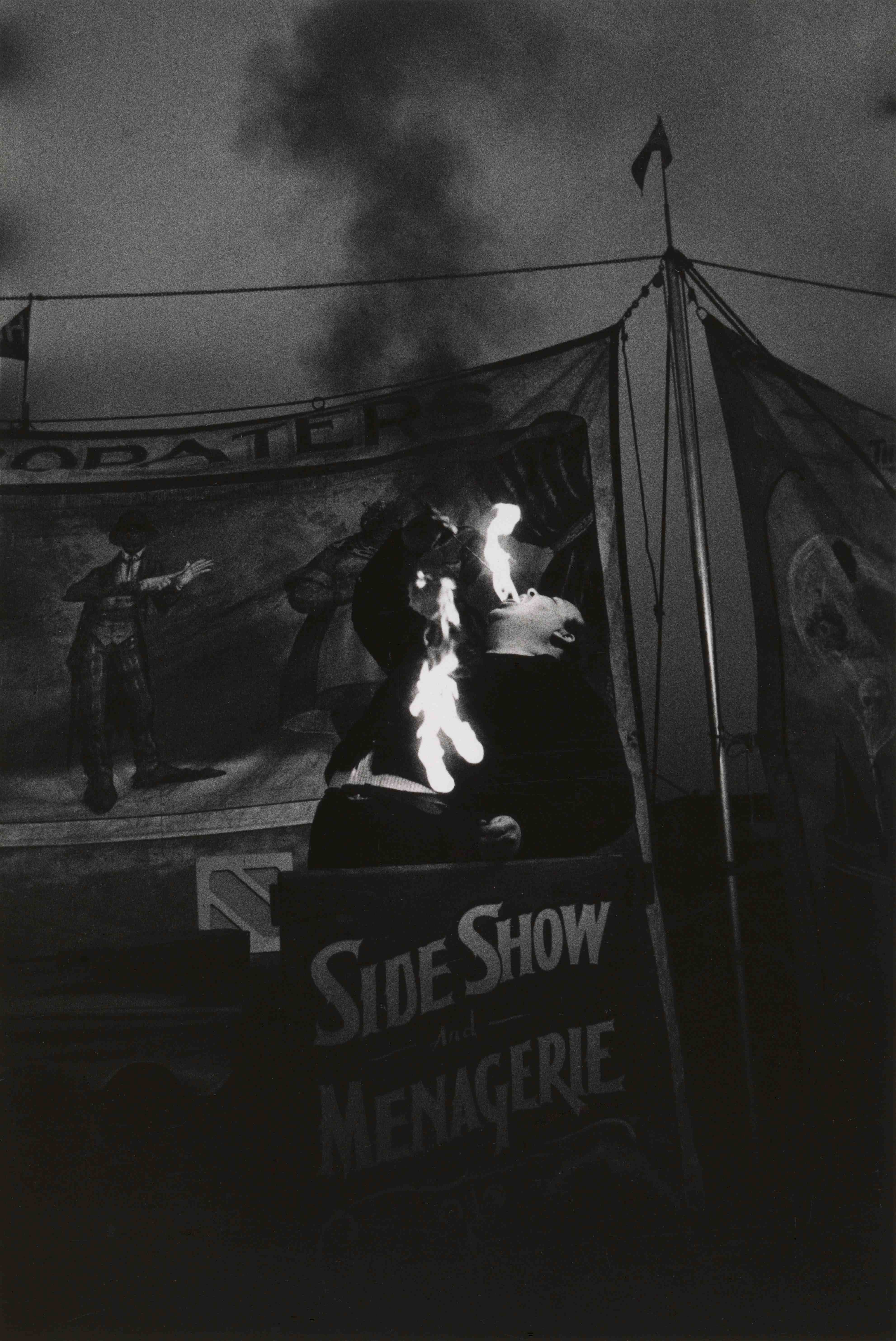 Diane Arbus. Fire Eater at a carnival, Palisades Park, N.J. 1957.