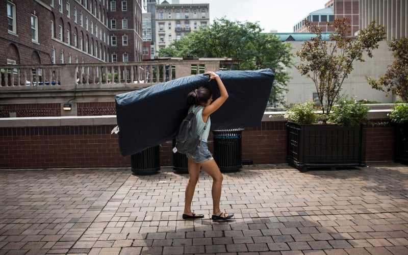 Emma Sulkowicz, Mattress Performance, Carry That Weight, 2014–15. Courtesy of Andrew Burton/Getty.