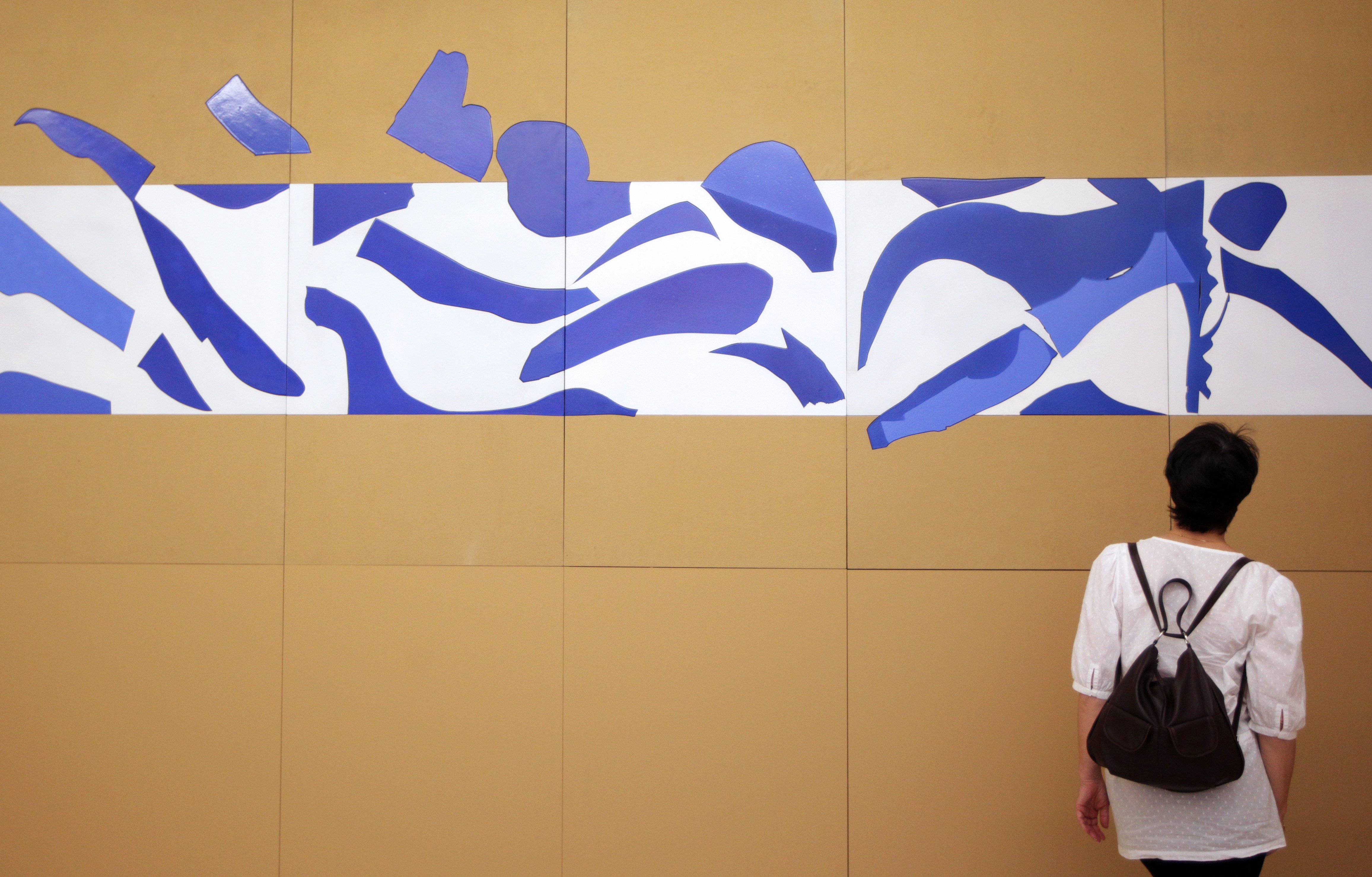 A visitor looks at the art work "La piscine" inspired by French artist Henri Matisse at the Matisse Museum on June 20, 2013 in Nice, southeastern France. Photo: JEAN CHRISTOPHE MAGNENET/AFP/Getty Images.