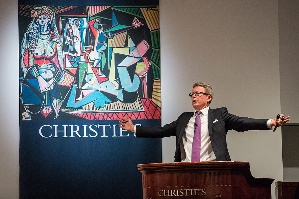 Jussi Pylkkanen, global president of Christie's, takes bids Pablo Picasso's <i>Les femmes d'Alger (Version O)</i> at Christie's on May 11, 2015 in New York City. Courtesy of Andrew Burton/Getty Images.